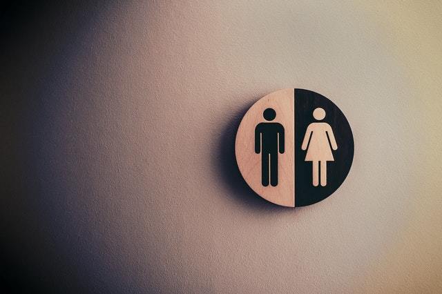 a male/female sign on a bathrom door