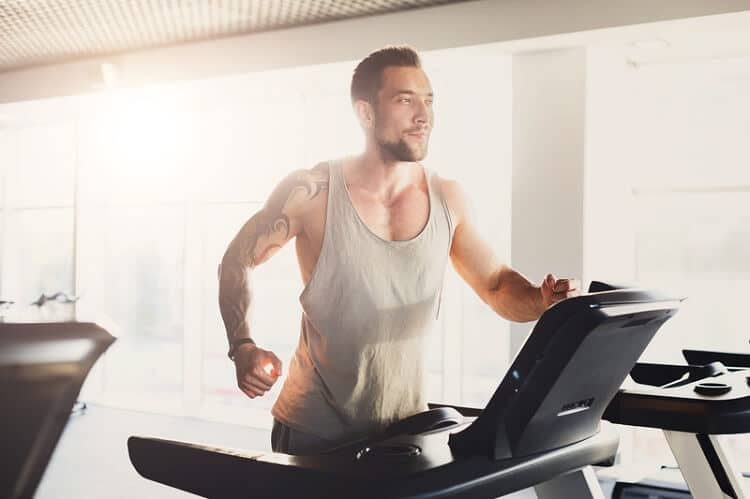 man using curved treadmill quietly