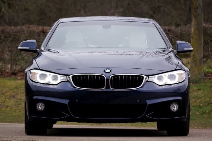 blue bmw 4 series with acoustic windshield