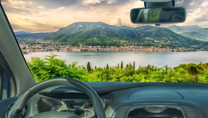looking through a car windshield onto italian lake