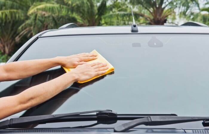 remove squeaky wax and windscreen film from your windshield
